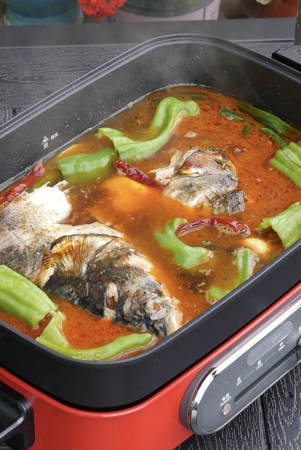 the steps of a spicy fish head stew